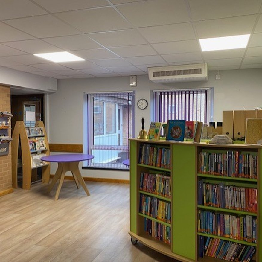 I painted grey trade emulsion onto the walls in a  School Library in Gorsleyin Herefordshire