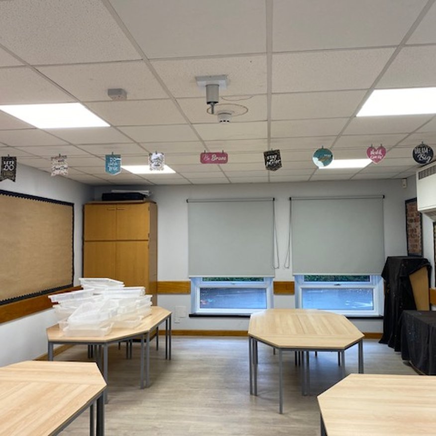 I painted using a roller a light grey emulsiononto the walls of a school classroom