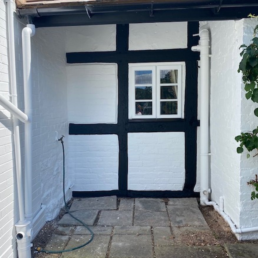 I painted using a paintrush and roller white trade emulsion onto the exterior walls on a cottage Gloucestershire